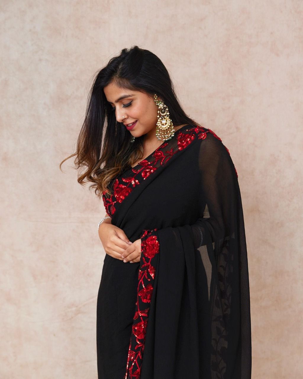 Beautiful black colour with red embroidery and sequence work lace border saree