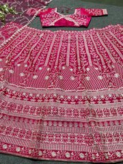 Rani pink colour embroidered silk lehenga choli